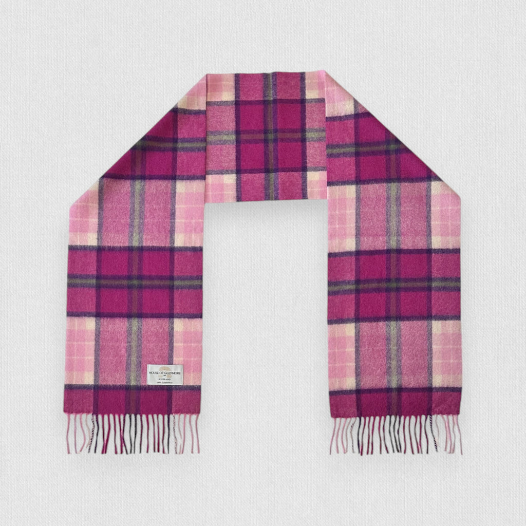 A Billet Pink tartan scarf made of 100% lambswool, displayed on a plain background, with a pattern of soft pink and rich grey lines crossed by lighter tartan stripes, and fringes at the ends.