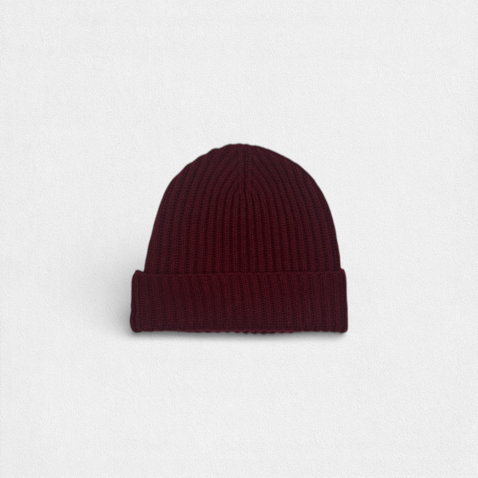 Maroon 100% cashmere beanie on a white background.