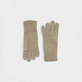 Pair of beige gloves on a white background