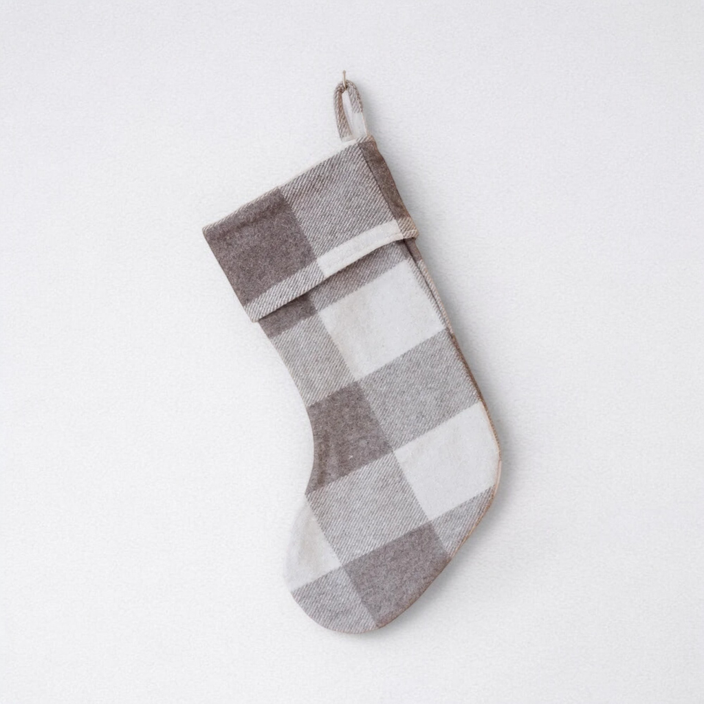 The Jacob tartan 100% wool Christmas stocking hanging against a plain background.