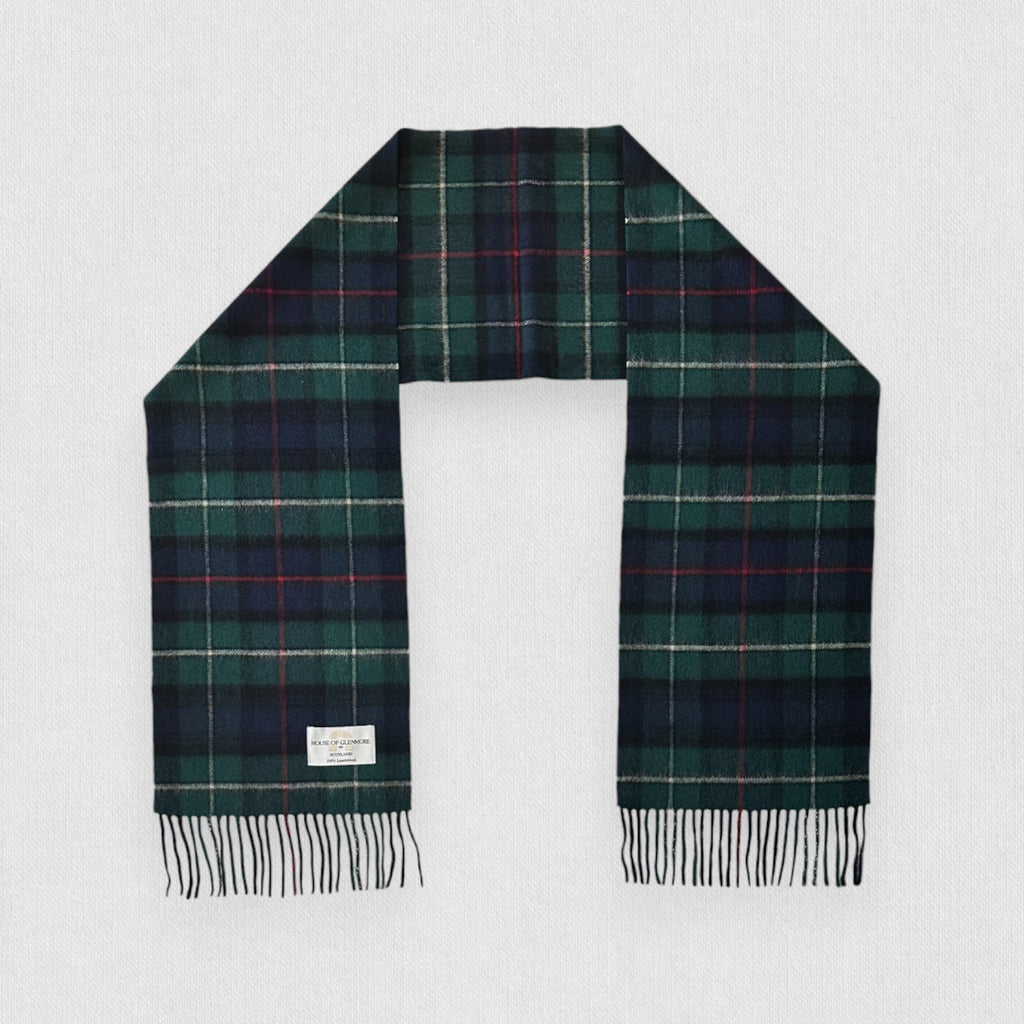 MacKenzie tartan scarf with fringes on a light gray background
