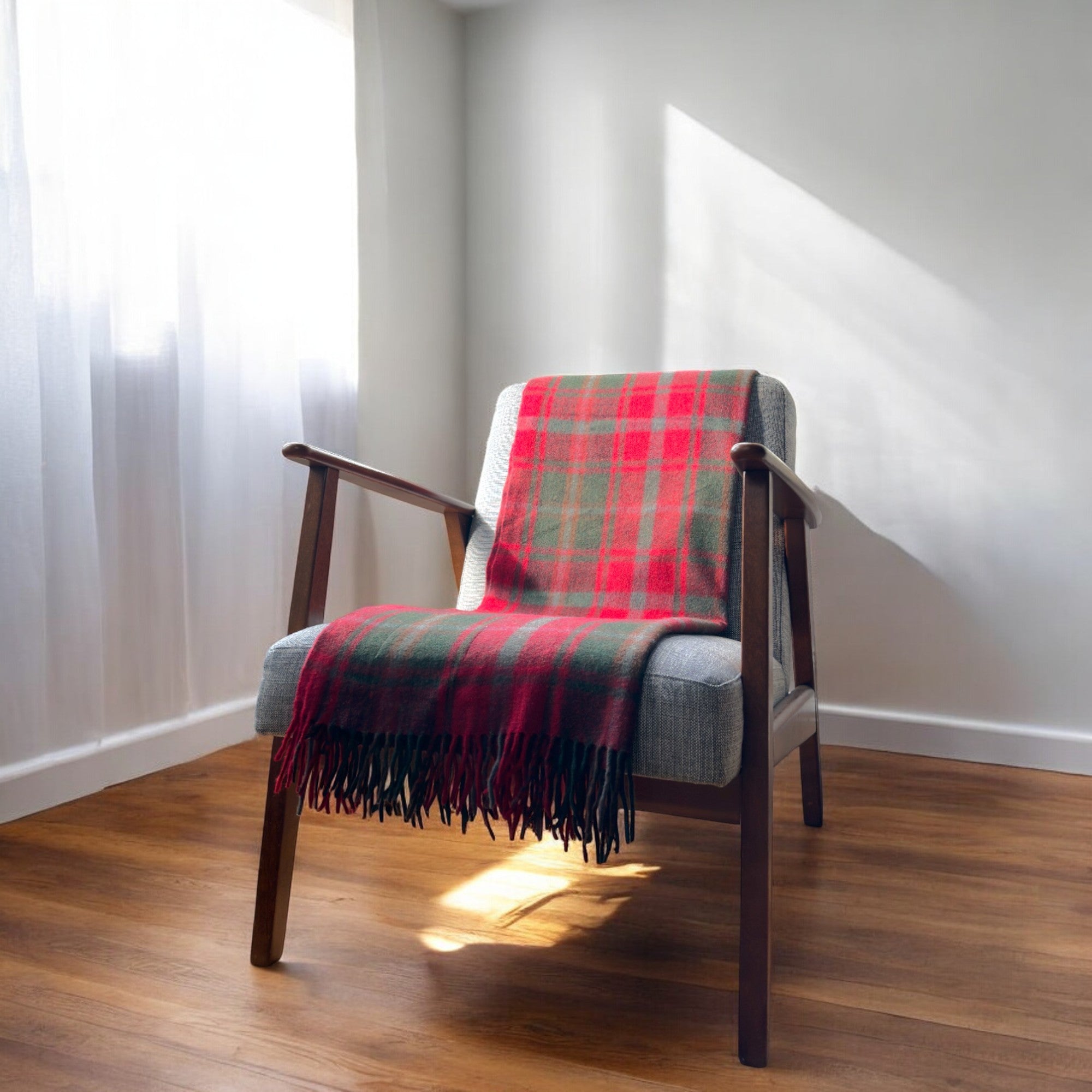 a maple blanket draped over a chair in a cosy room