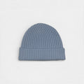 Blue tone 100% cashmere ribbed beanie on a white background.