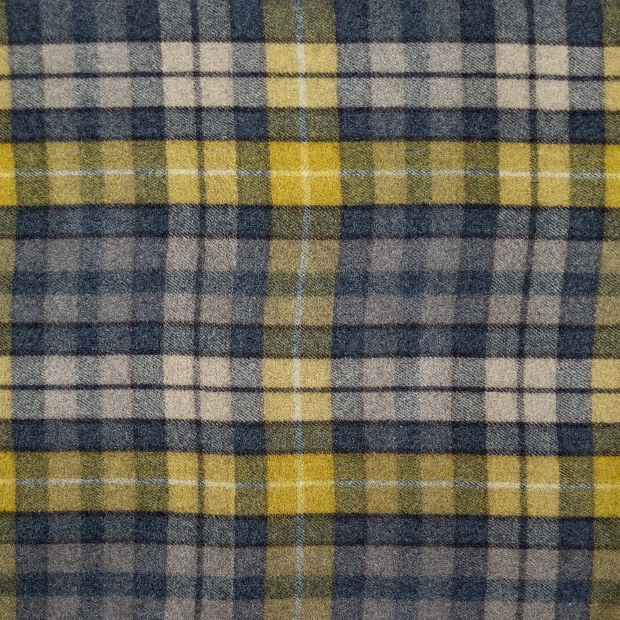 A close up of the Natural Buchanan tartan, Natural Buchanan has yellow, grey and cream tones in a checkered pattern.
