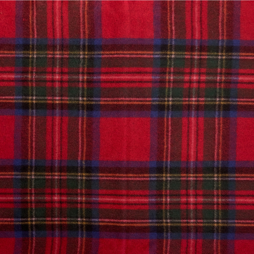 A close up of the Royal Stewart tartan, the Royal Stewart tartan has red, blue, yellow and green in a checkered pattern.