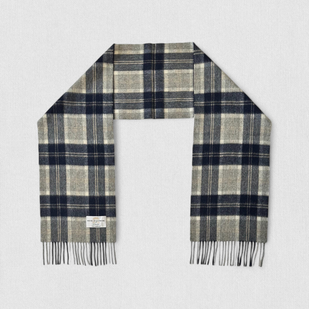 Silver bannockbane tartan lambswool scarf with fringes on a light gray background