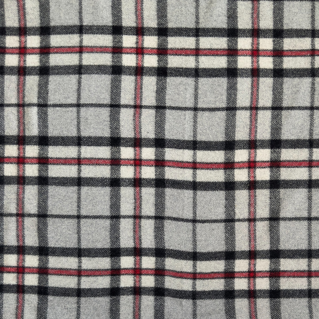 A close up of the Thomson Grey tartan. Thomson Grey tartan has grey, red, black and white stripes in a checkered pattern.
