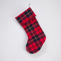 The Wallace tartan Christmas stocking hanging against a white background.